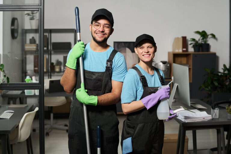 Colleagues Doing Cleaning In Team In Office